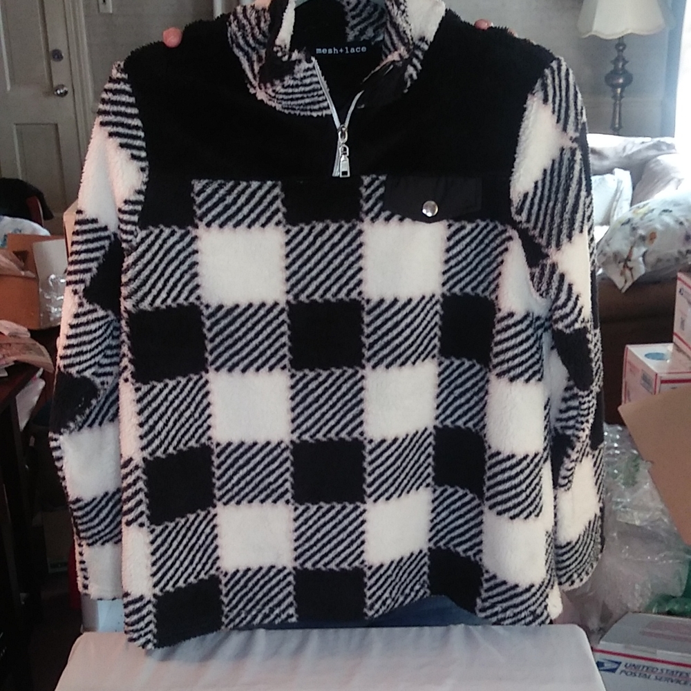 Dressy fleece pull over with quarter zipper.